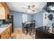 Eat-in kitchen features oak cabinets, ceiling fan and table with seating for four at 120 Hoss Rd, Indianapolis, IN 46217