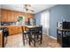 Charming kitchen with oak cabinets, stainless steel appliances, and cozy dining table set at 120 Hoss Rd, Indianapolis, IN 46217