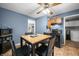 Eat-in kitchen featuring ceiling fan, seating for four, and stainless steel appliances at 120 Hoss Rd, Indianapolis, IN 46217
