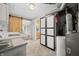 Large laundry room including a folding table, and sliding barn door entry to another room at 120 Hoss Rd, Indianapolis, IN 46217