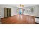 Spacious living room with gleaming hardwood floors and a bright blue front door at 120 Hoss Rd, Indianapolis, IN 46217