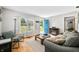 Bright living room with hardwood floors, neutral walls, and comfortable seating arrangement at 120 Hoss Rd, Indianapolis, IN 46217