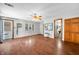 Open living room featuring a ceiling fan, hardwood floors, and a glimpse of the bathroom at 120 Hoss Rd, Indianapolis, IN 46217