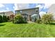 Spacious backyard with lush lawn, greenery, patio, and pergola for outdoor enjoyment at 1217 Old Vines Trl, Greenwood, IN 46143