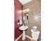 Compact bathroom with a stylish mosaic tile wall, pedestal sink, and modern fixtures at 1217 Old Vines Trl, Greenwood, IN 46143