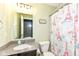 Bathroom featuring granite countertop vanity, toilet, and an Eiffel Tower themed shower curtain at 1217 Old Vines Trl, Greenwood, IN 46143