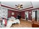 This bedroom has wood floors and a ceiling fan at 1217 Old Vines Trl, Greenwood, IN 46143
