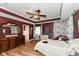 This bedroom has wood floors and a ceiling fan at 1217 Old Vines Trl, Greenwood, IN 46143
