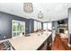 This kitchen has hardwood floors, an island, granite counters and stainless steel appliances at 1217 Old Vines Trl, Greenwood, IN 46143