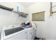 A bright laundry room featuring a new washing machine and dryer and a decorative sign at 1217 Old Vines Trl, Greenwood, IN 46143