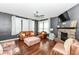 Cozy living room with fireplace, hardwood floors, and ample seating, perfect for relaxing or entertaining at 1217 Old Vines Trl, Greenwood, IN 46143