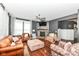 Bright living room with a fireplace, hardwood floors, comfortable seating, and a large window for natural light at 1217 Old Vines Trl, Greenwood, IN 46143