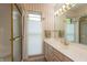 Cozy bathroom featuring classic gold fixtures, a glass shower, and a vanity with ample storage at 1220 Pintail Ct, Columbus, IN 47201
