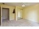 A simple bedroom with neutral carpet, a mirrored closet door, and a ceiling fan at 1220 Pintail Ct, Columbus, IN 47201