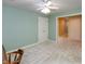 A simple bedroom with neutral carpet, two closets and views to an en-suite bathroom at 1220 Pintail Ct, Columbus, IN 47201