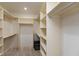 Bright walk-in closet featuring custom shelving and rod system for optimal storage at 1220 Pintail Ct, Columbus, IN 47201