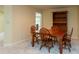 Cozy dining room featuring wood furnishings, neutral carpet, and overhead lighting at 1220 Pintail Ct, Columbus, IN 47201