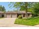 Charming brick ranch home with a well-manicured lawn and an attached two-car garage at 1220 Pintail Ct, Columbus, IN 47201
