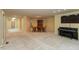 Open living room with neutral carpet, piano, dining table, and recessed lighting at 1220 Pintail Ct, Columbus, IN 47201