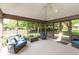 Cozy screened-in sunroom with comfortable seating, perfect for relaxing outdoors at 1220 Pintail Ct, Columbus, IN 47201