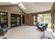 Beautiful screened-in sunroom featuring brick walls, skylights and wicker furniture at 1220 Pintail Ct, Columbus, IN 47201