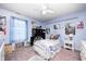Light blue bedroom with an ornamental metal bedframe, plush carpet, and natural light at 13068 Lamarque Pl, Fishers, IN 46038