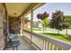 Relaxing covered porch with rocking chairs and views of the surrounding neighborhood at 13068 Lamarque Pl, Fishers, IN 46038