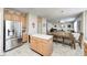 Open concept kitchen with stainless steel refrigerator and view of dining and living area at 13068 Lamarque Pl, Fishers, IN 46038