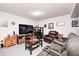 Finished basement area with couch, television, end tables, and decorations at 13068 Lamarque Pl, Fishers, IN 46038