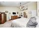 A comfortable main bedroom features tall ceilings, a ceiling fan and neutral carpeting at 13068 Lamarque Pl, Fishers, IN 46038