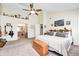 Large main bedroom has a vaulted ceiling, ceiling fan and a doorway to the main bath at 13068 Lamarque Pl, Fishers, IN 46038