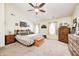 Spacious main bedroom with vaulted ceiling, ceiling fan, and multiple windows at 13068 Lamarque Pl, Fishers, IN 46038