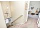 Carpeted staircase leading to the upper level of the home with a view of the front door at 13068 Lamarque Pl, Fishers, IN 46038