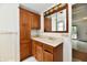 Bathroom featuring a vanity with ample storage and a classic mirror at 1346 W 27Th St, Indianapolis, IN 46208