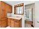 Bathroom featuring a vanity with ample storage and a classic mirror at 1346 W 27Th St, Indianapolis, IN 46208
