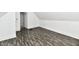 A bedroom showcasing the hardwood floors and neutral walls with access to another room at 1346 W 27Th St, Indianapolis, IN 46208