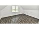 A bedroom showcasing the window and hardwood floors with neutral walls at 1346 W 27Th St, Indianapolis, IN 46208