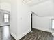 Open bedroom area features hardwood floors, dormer windows, and multiple entryways at 1346 W 27Th St, Indianapolis, IN 46208