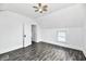 Well-lit bedroom featuring hardwood floors, fresh paint, window with blinds and a fan on the ceiling at 1346 W 27Th St, Indianapolis, IN 46208