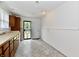 Functional kitchen featuring wood cabinets, neutral countertops, and natural light at 1346 W 27Th St, Indianapolis, IN 46208