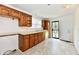 Functional kitchen featuring wood cabinets, neutral countertops, and natural light at 1346 W 27Th St, Indianapolis, IN 46208