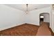 Spacious living room showcasing hardwood floors and an open archway to other spaces at 1346 W 27Th St, Indianapolis, IN 46208
