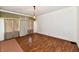 Bright living room featuring hardwood floors, decorative lighting, and classic trim at 1346 W 27Th St, Indianapolis, IN 46208