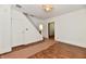 Living room featuring hardwood floors, white walls and staircase at 1346 W 27Th St, Indianapolis, IN 46208