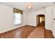 Living room featuring hardwood floors, white walls, and a large window for plenty of light at 1346 W 27Th St, Indianapolis, IN 46208