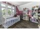Bedroom features wood floors, pink walls and a white daybed at 1393 Wayne St, Noblesville, IN 46060