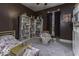 Bedroom features carpet, brown walls and a queen bed at 1393 Wayne St, Noblesville, IN 46060