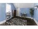 Bedroom features wood floors, blue walls and a black and white rug at 1393 Wayne St, Noblesville, IN 46060