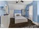 Bedroom features wood floors, blue walls and a full bed at 1393 Wayne St, Noblesville, IN 46060