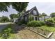 Quaint two-story home with mature trees, front landscaping and brick driveway at 1393 Wayne St, Noblesville, IN 46060